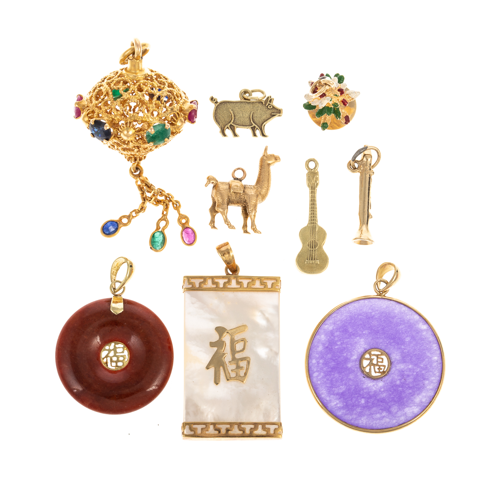 Appraisal: A COLLECTION OF GOLD CHARMS PENDANTS Nine charms and pendants