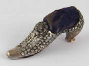 Appraisal: A late Victorian silver pincushion formed as a lady's shoe