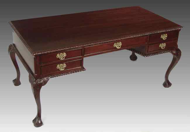 Appraisal: CHIPPENDALE STYLE WRITING TABLE Mahogany writing table with gadroon edging