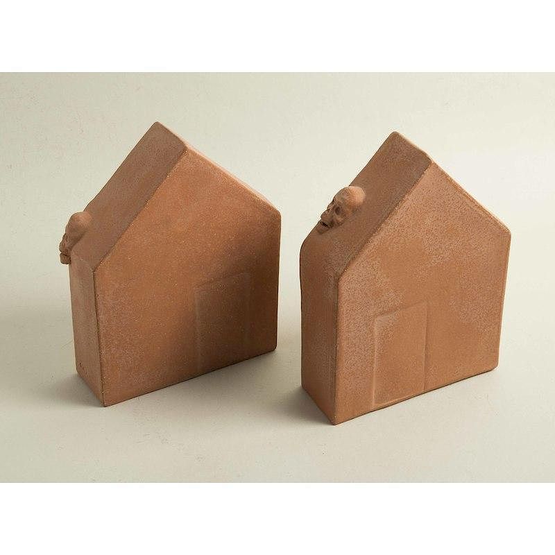 Appraisal: Two Pottery Skull Houses Carol Lawton Two pottery houses bearing