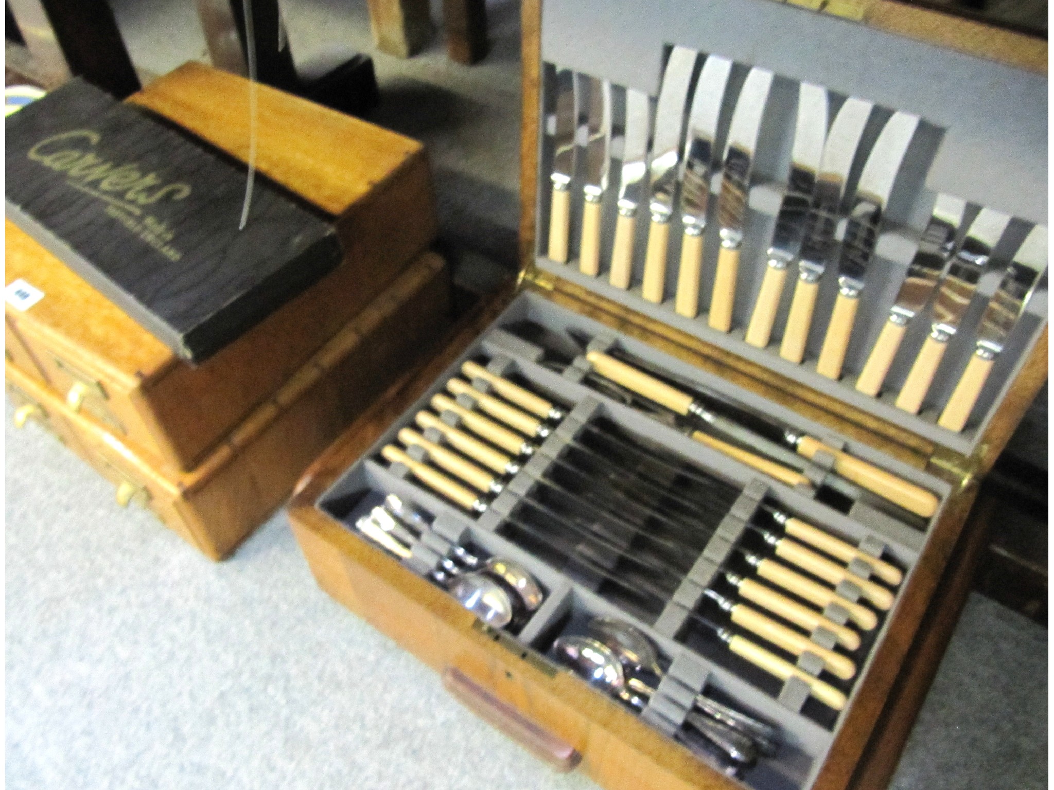 Appraisal: A lot comprising an oak canteen of cutlery a carving