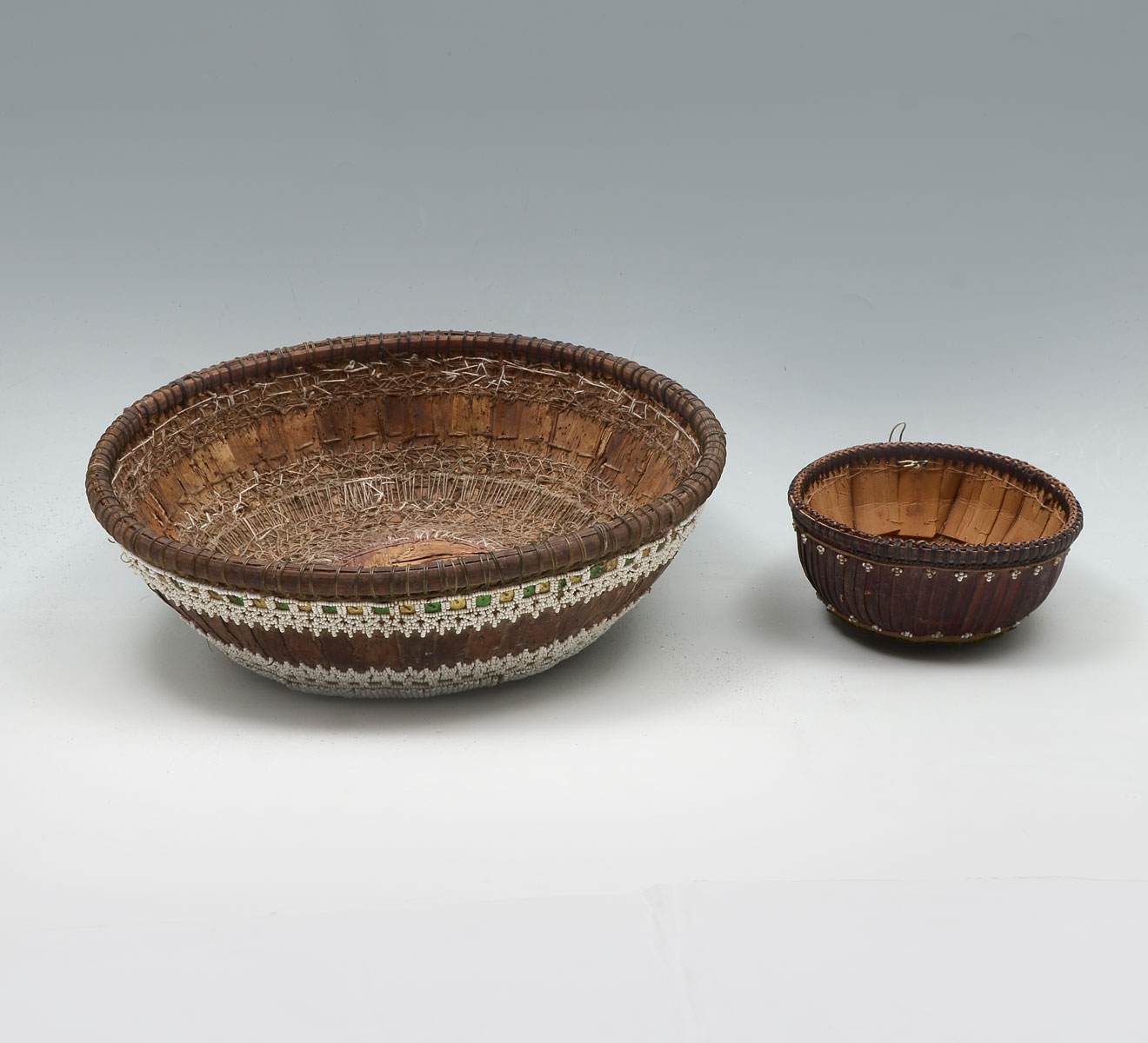 Appraisal: EARLY AMERICAN INDIAN BEADED BASKETS Comprising large having green yellow