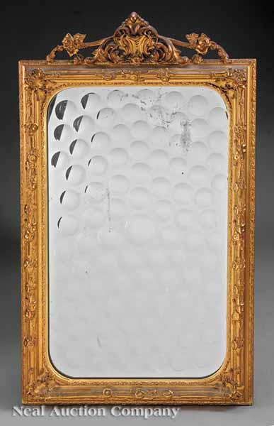 Appraisal: A Continental Carved and Gilded Mirror th c the rectangular