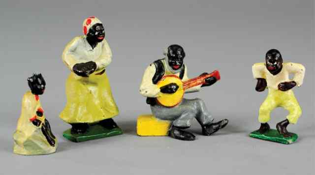 Appraisal: BLACK AMERICAN PAPERWEIGHT GROUPING Hubley cast iron includes dancing man