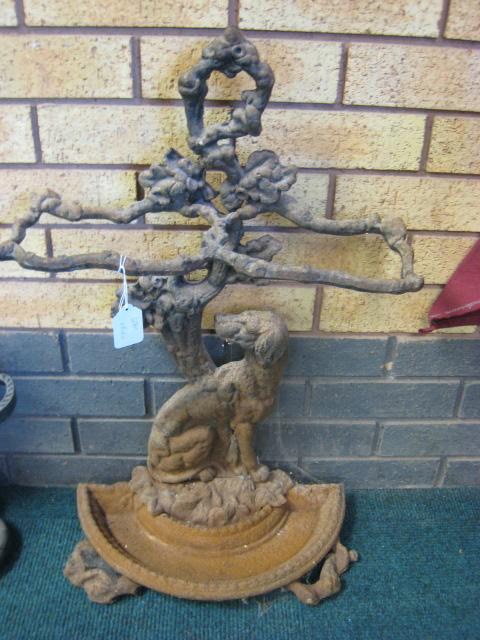 Appraisal: A cast iron Stick Stand with seated dog and leafage