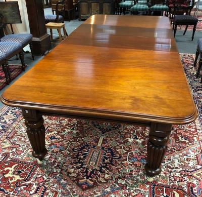 Appraisal: A late th Century mahogany wind-out dining table with three