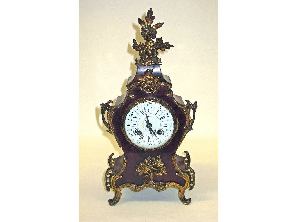 Appraisal: A Louis XV style tortoiseshell and ormolu mantel clock with