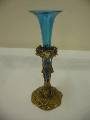 Appraisal: A BRASS EPERGNE with turquoise glass trumpet rising from a