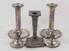 Appraisal: Sterling silver Two pairs of candlesticks and a single example