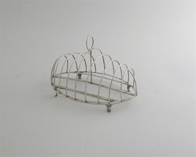 Appraisal: A George III Scottish provincial bannock rack navette shaped with