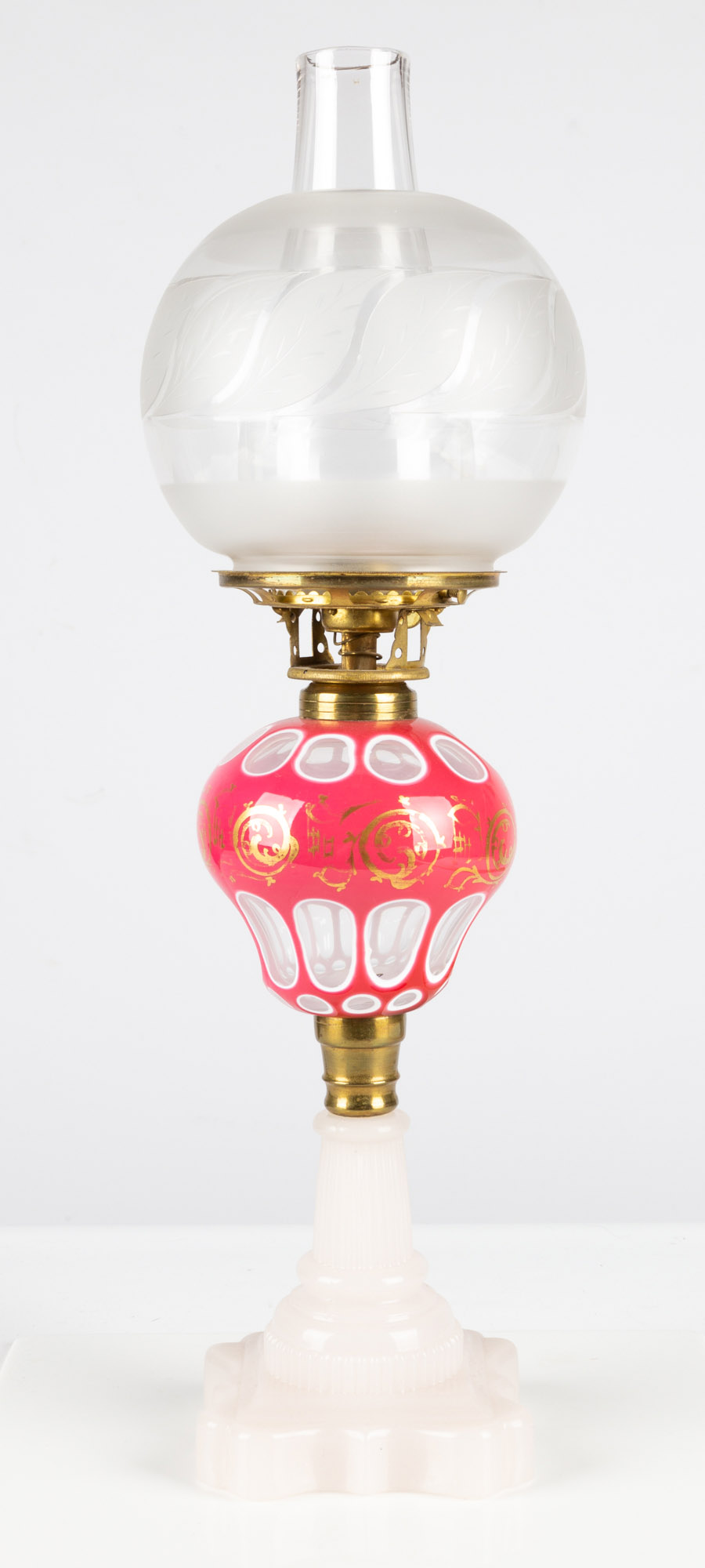 Appraisal: PINK OVERLAY OPALINE OIL LAMP circa deep pink glass cut