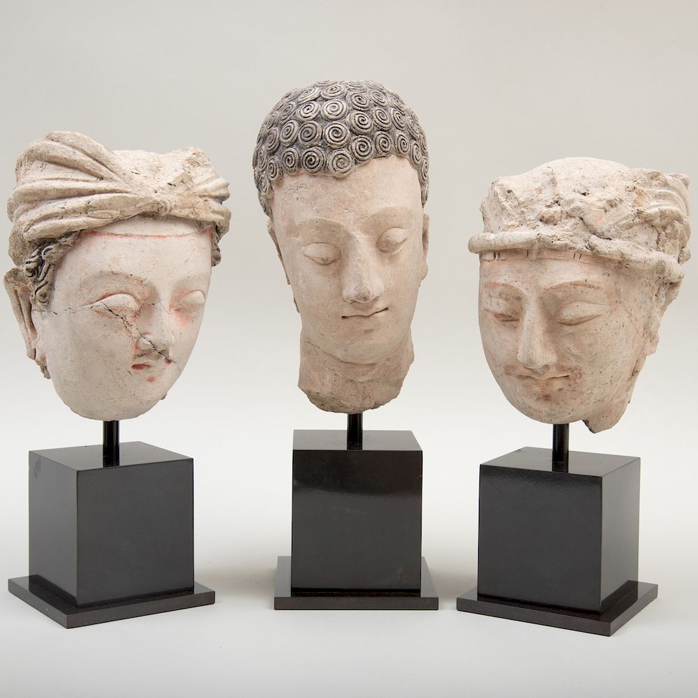 Appraisal: Group of Three Gandharan Clay Heads Group of Three Gandharan