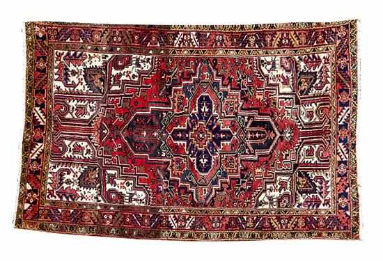 Appraisal: Persian Heriz carpet ' '' x ' minor loss to