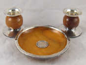 Appraisal: A silver mounted wooden dish with central silver coin inset