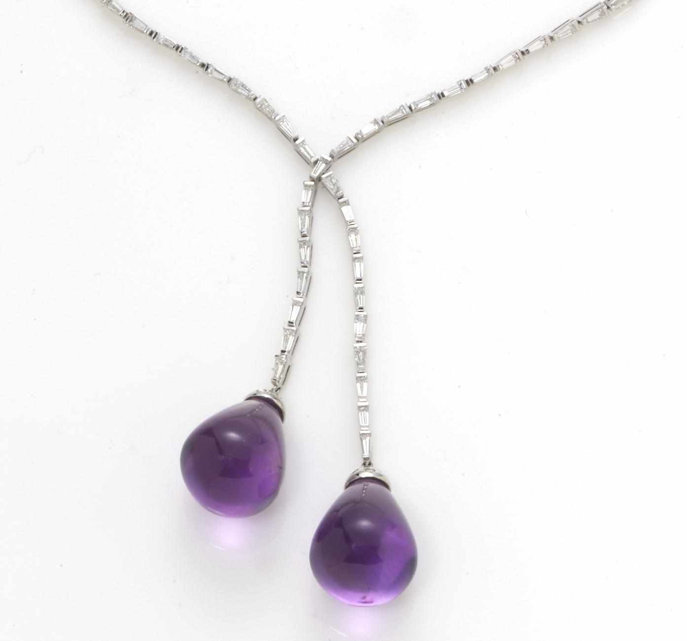 Appraisal: A diamond and amethyst lavalier necklace featuring two drop-shaped amethyst