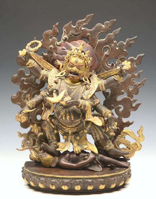 Appraisal: A BRONZE FIGURE OF MAHAKALA with the primary two hands