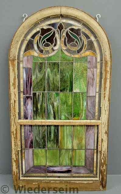 Appraisal: Large arched wood framed leaded stained glass window late th