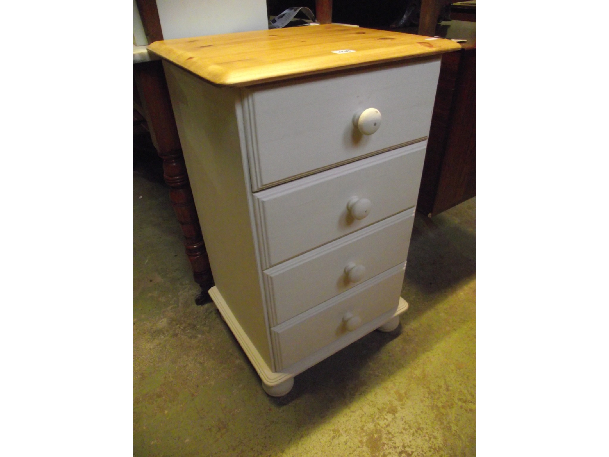 Appraisal: A contemporary partially painted pine four drawer pedestal bedside chest