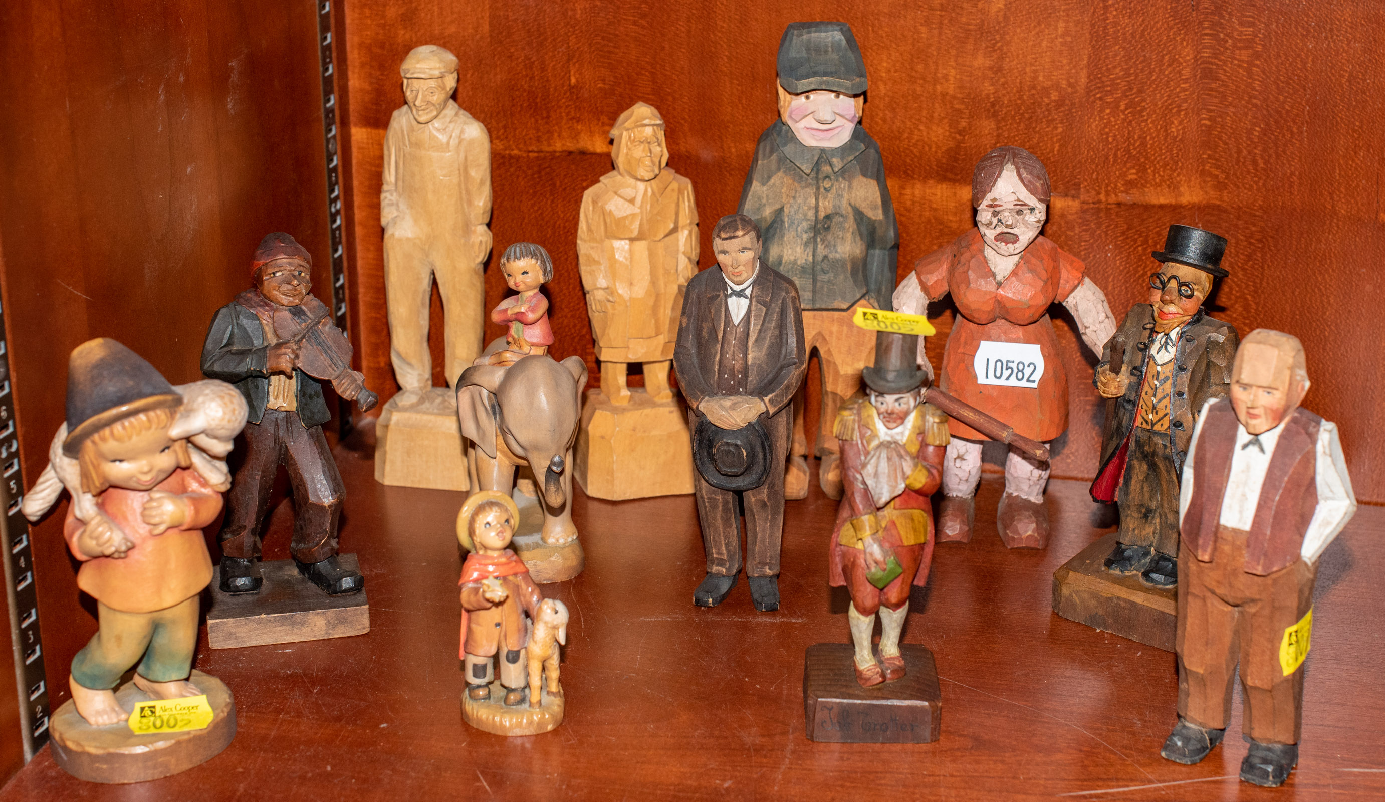 Appraisal: SELECTION OF CARVED WOODEN FIGURES By various craftsmen most mid