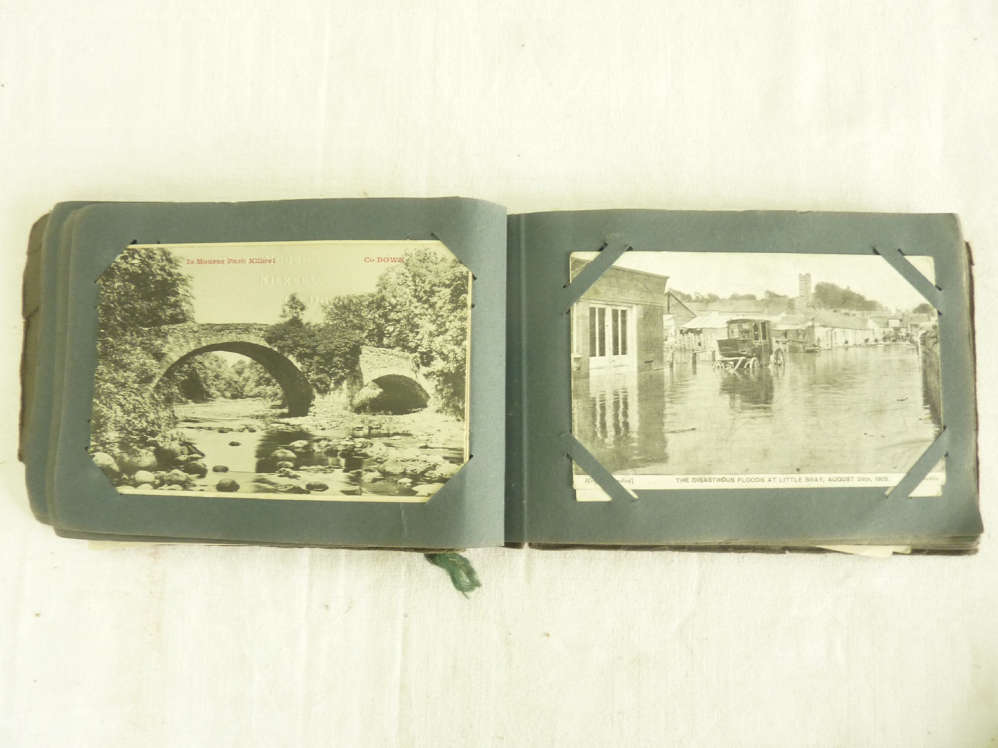 Appraisal: An Edwardian postcard album containing a collection of postcards detailing