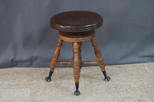 Appraisal: Antique Charles Parker Piano Stool ca With cast iron talon