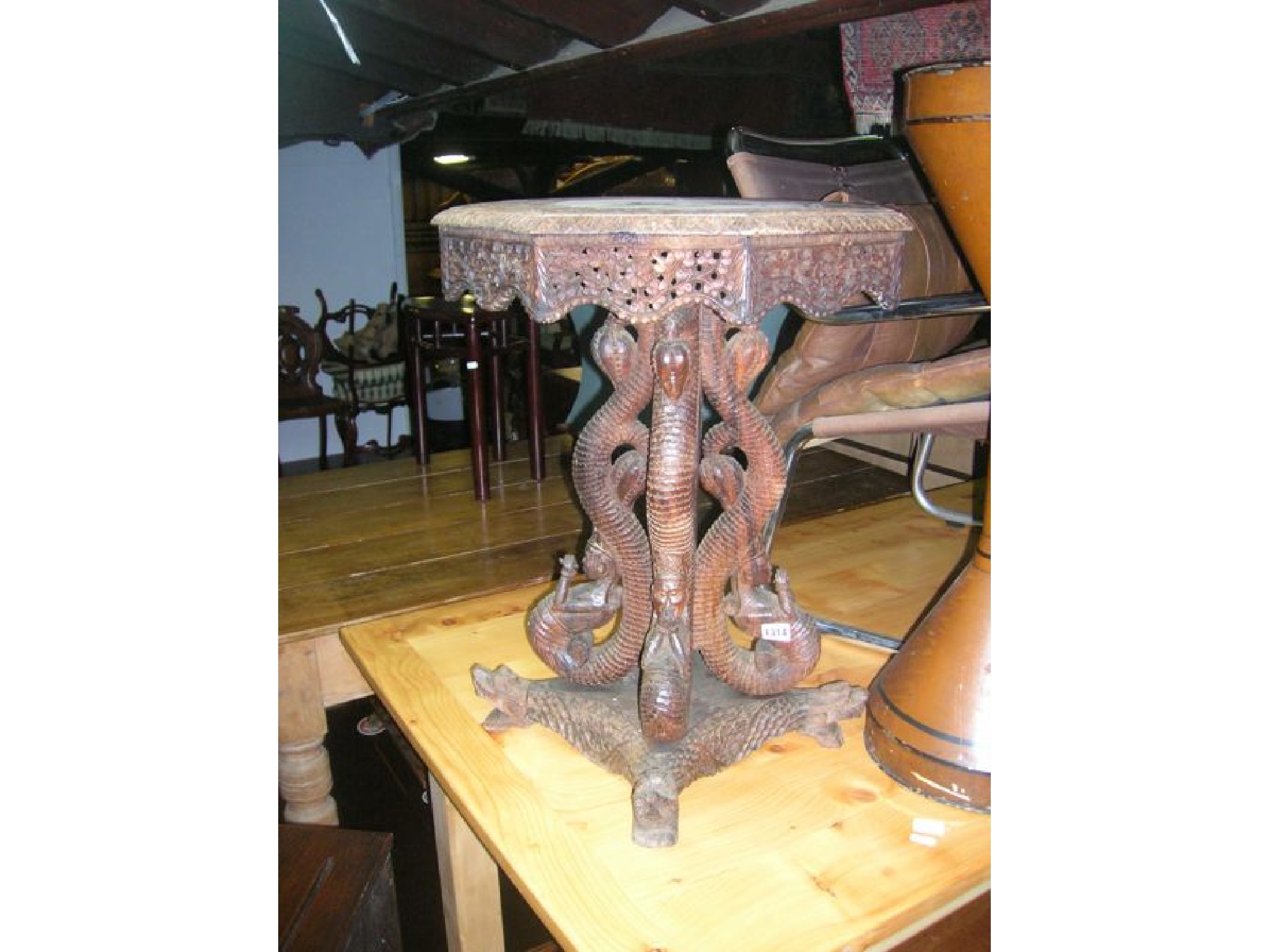 Appraisal: An Indonesian hardwood occasional table of octagonal form with profusely