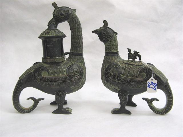 Appraisal: PAIR CHINESE CAST METAL FIGURAL BIRD VESSELS the first with