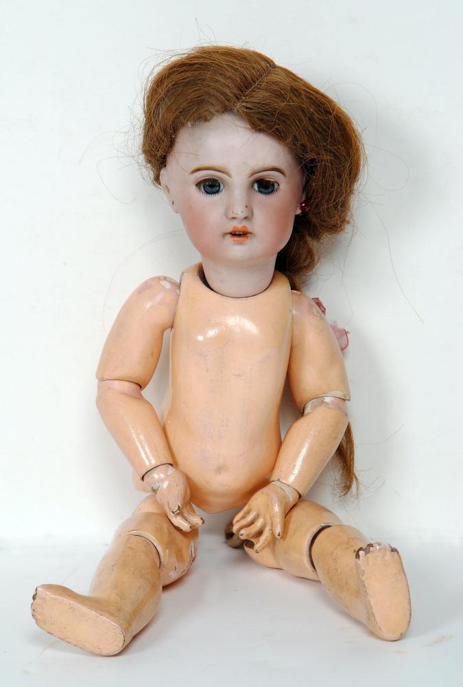 Appraisal: A Jumeau Bebe bisque head girl doll with blue glass