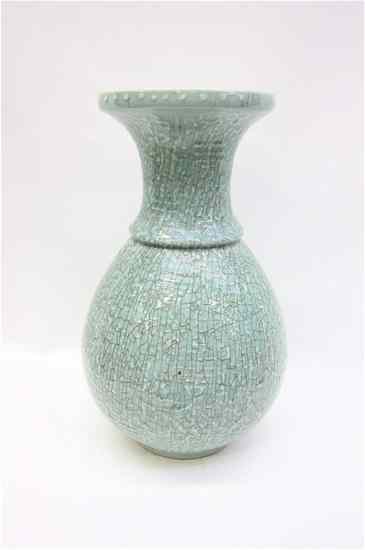 Appraisal: CHINESE CELEDON PORCELAIN VASE with crackle finish and a raised