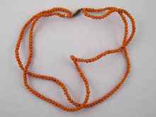 Appraisal: A double row coral bead necklace approx cm