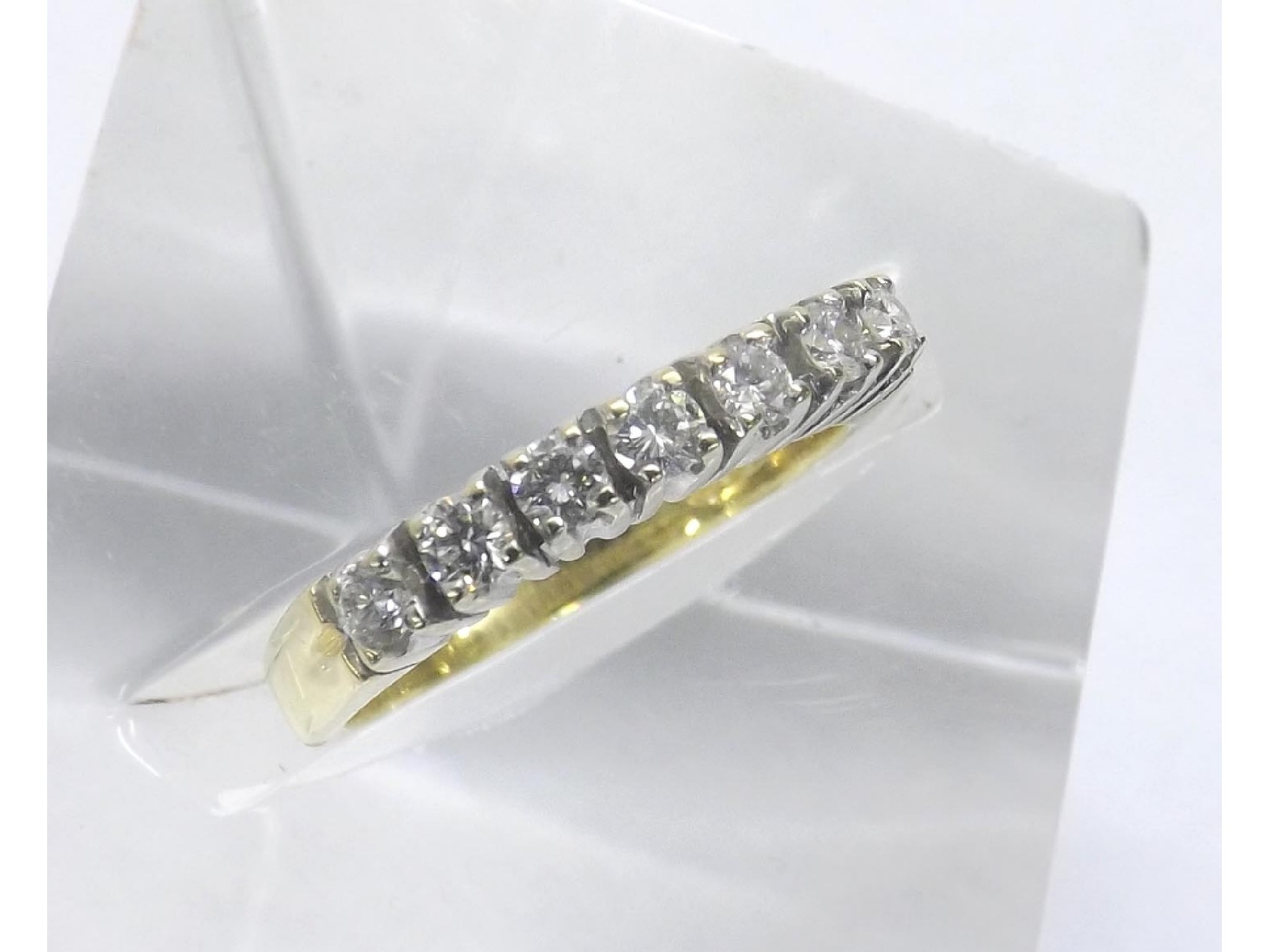 Appraisal: - -a ct seven stone brilliant-cut diamond half hoop ring