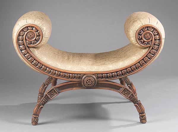 Appraisal: An Italian Renaissance-Style Carved Fruitwood Curule Bench the scrolled arms