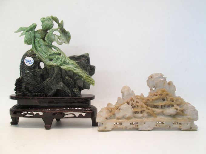 Appraisal: TWO CHINESE CARVED HARDSTONE FIGURES the first of a tea