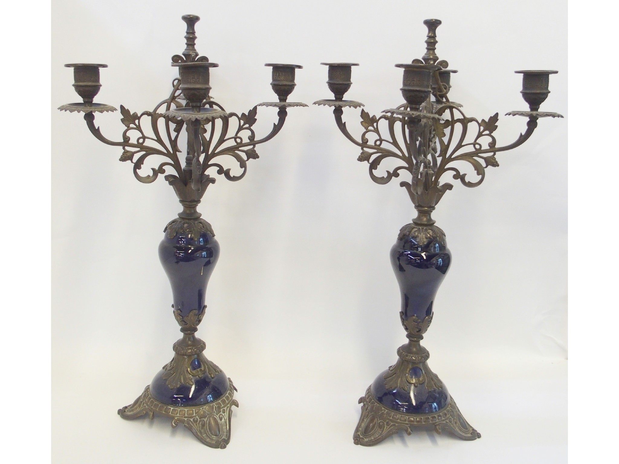 Appraisal: Pair of patinated metal and cobalt porcelain candelabra