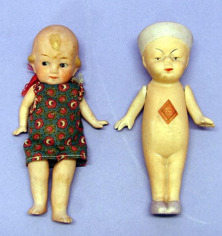 Appraisal: Pair of dolls Queue San Baby Boy Unmarked Molded lavender