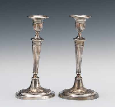 Appraisal: A Pair of Georgian Style Silver Plated Candlesticks Ovoid form