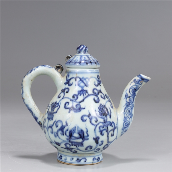 Appraisal: Chinese blue and white porcelain covered teapot with blue floral