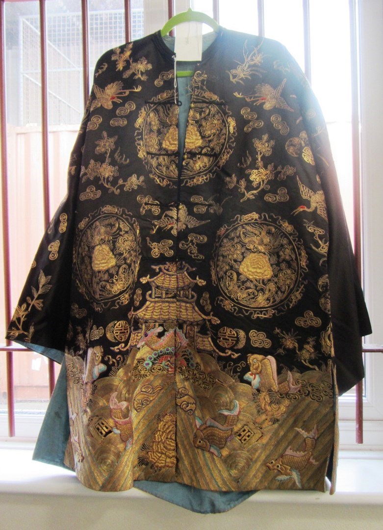 Appraisal: A Chinese black ground silk jacket th century worked with