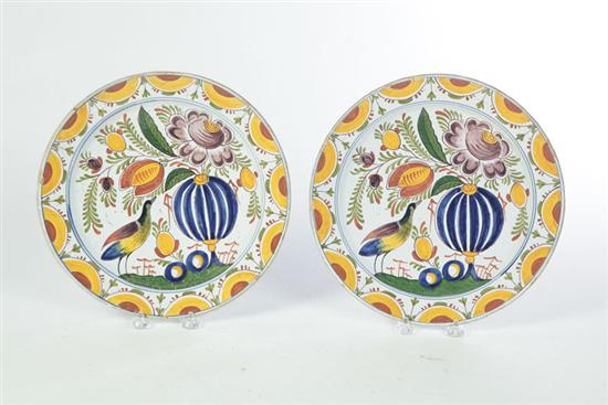 Appraisal: PAIR OF DELFT CHARGERS England early th century Polychrome design