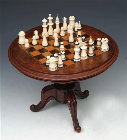 Appraisal: A TURNED IVORY CHESS SET high together with a miniature