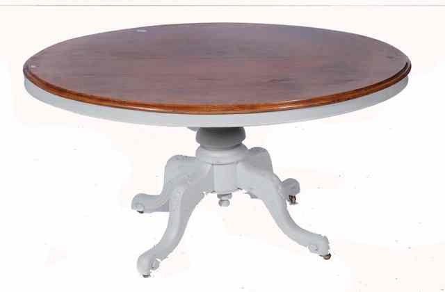 Appraisal: A VICTORIAN WALNUT OVAL DINING TABLE with moulded edge a