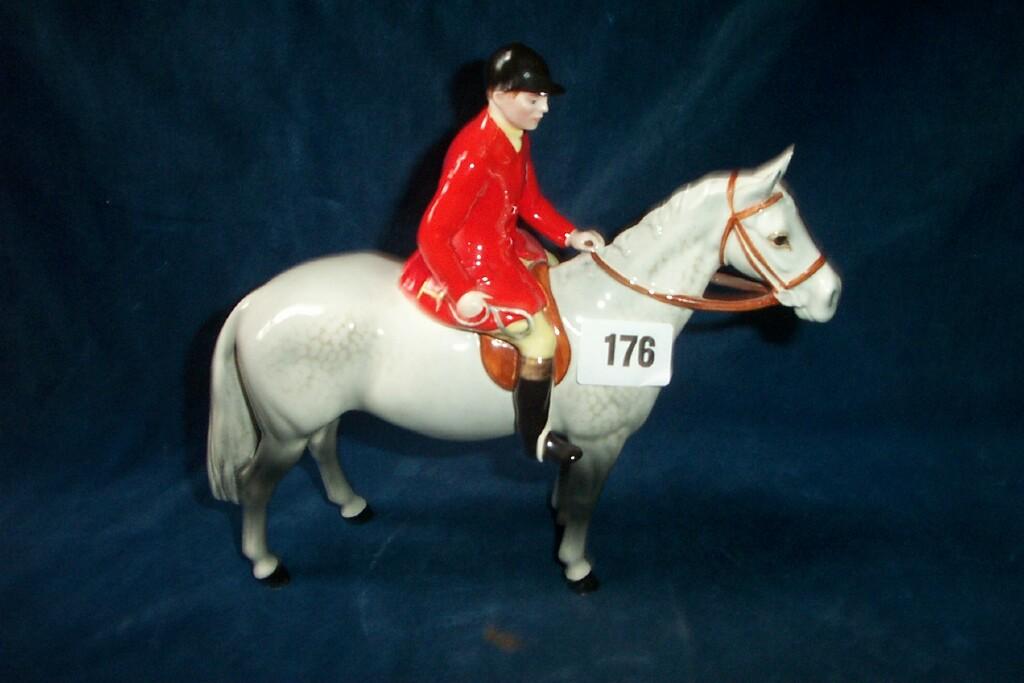 Appraisal: A Beswick model of a huntsman with red jacket mounted