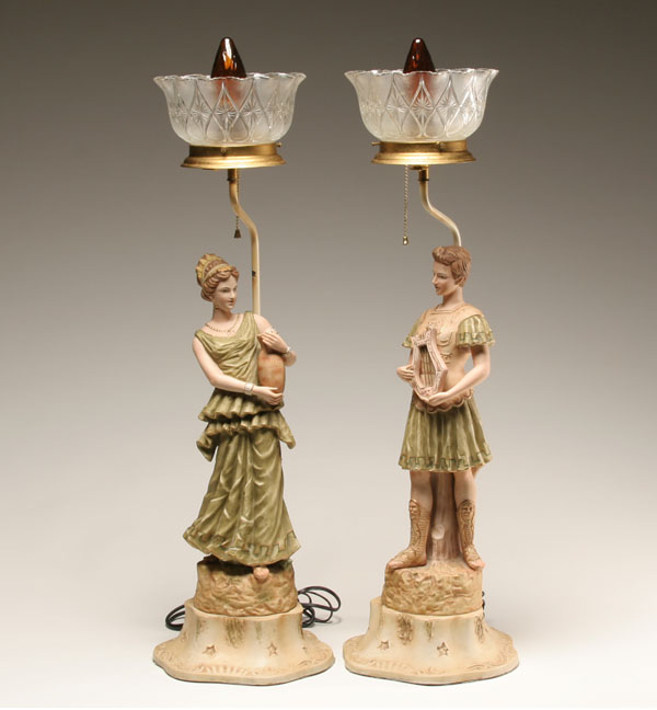 Appraisal: Pair bisque figural lamps Roman classical male and female figures