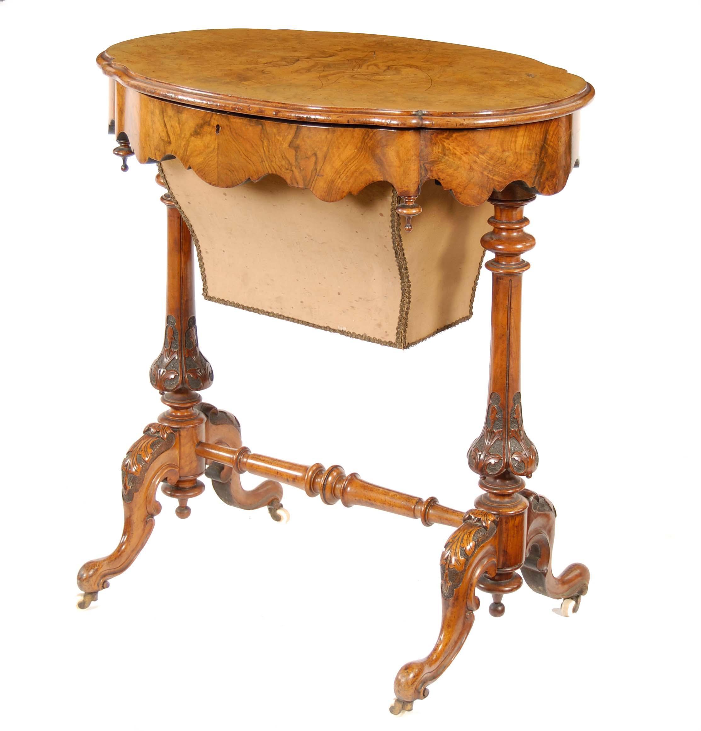 Appraisal: A Victorian walnut sewing table