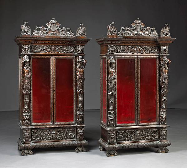 Appraisal: A pair of Renaissance style walnut vitrine cabinets last quarter