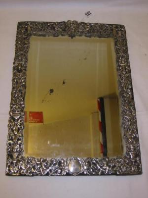 Appraisal: A VICTORIAN TOILET MIRROR of oblong form the bevelled plate