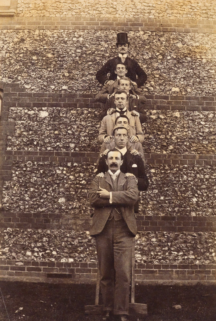 Appraisal: HUMOR Seven men ascending a brick wall Albumen print x