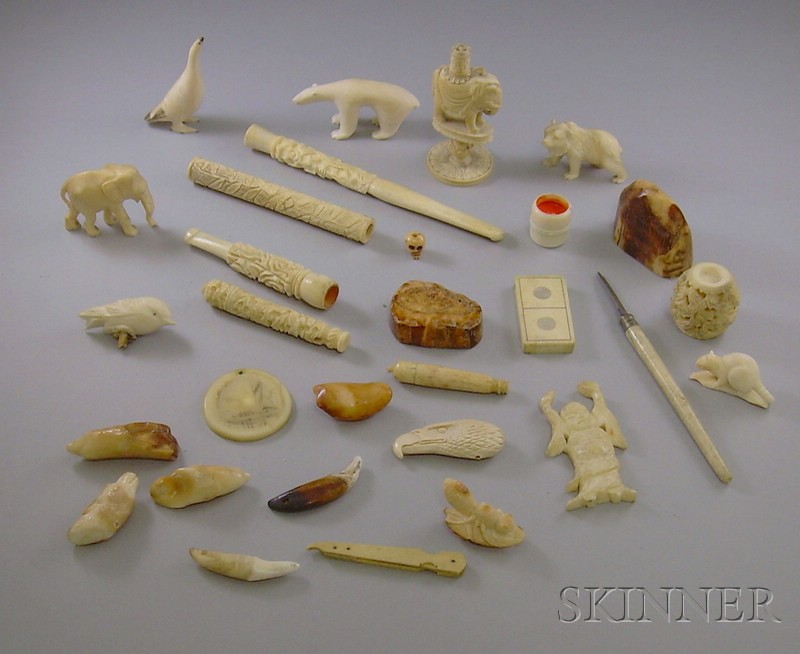 Appraisal: Approximately Twenty-six Ivory Carvings and Bone Fragments a scrimshaw pendant