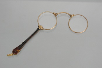 Appraisal: A Pair of Antique Tortoise Lorgnettes Fold-out lorgnettes with gold-tone