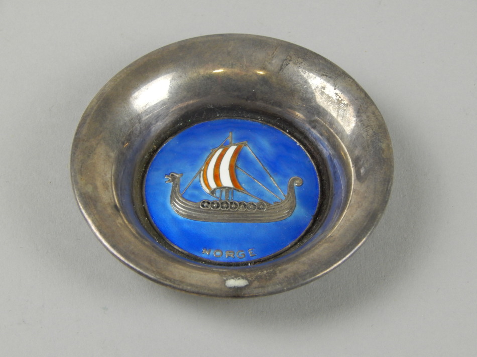 Appraisal: A white metal pin tray enamelled to the centre with